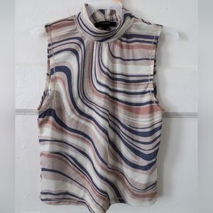 "Elevate Your Style with our Sleeveless Turtle Neck Top!"